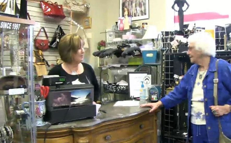 Kay at work, chatting with a customer