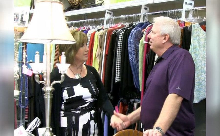 Kay and Marty holding hands in the shop