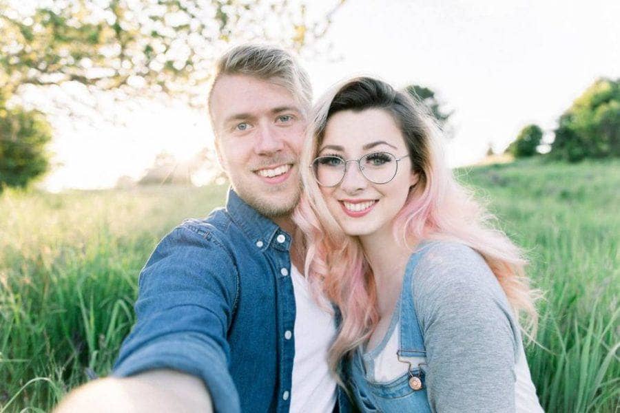 Brayden and Laura Faganello in a field of tall grass