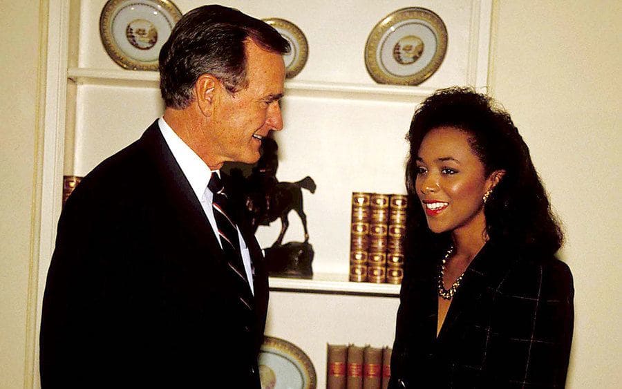 Miss America Debbye Turner standing next to George Bush Sr in 1989