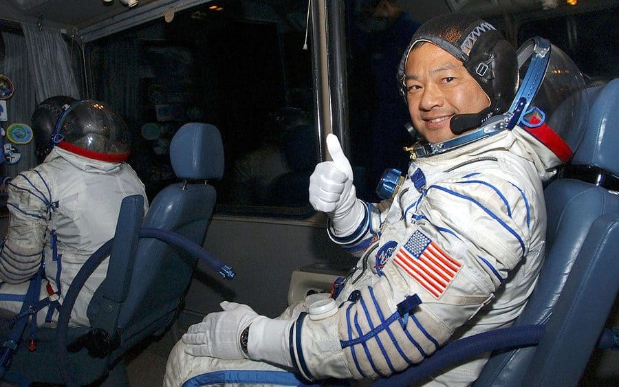 Leroy Chiao giving a thumbs up on the ride from suiting up to the launch pad with his crewmates