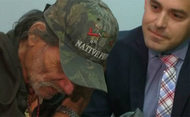 Mick being comforted by Sheriff Jacob Swalwell