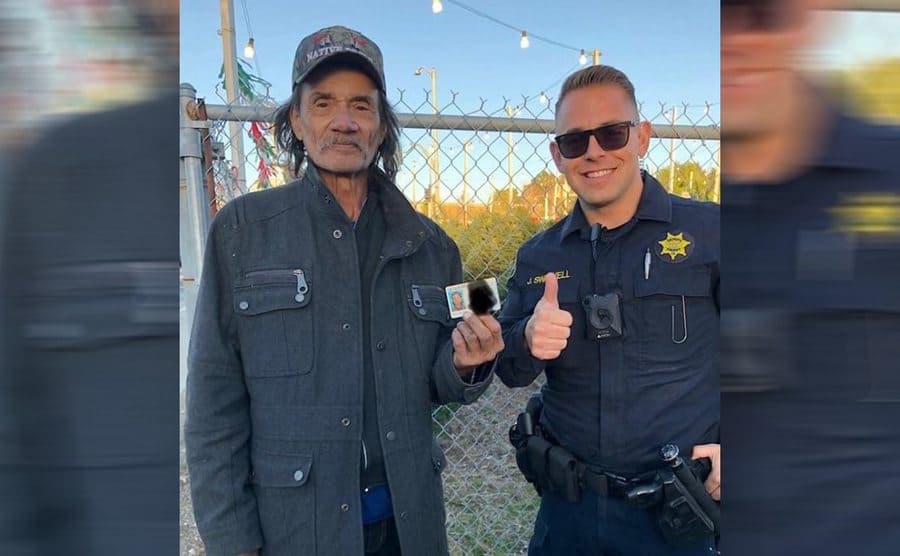 Mick holding his new ID with Deputy Swalwell