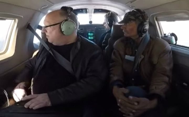 Mick on a plane