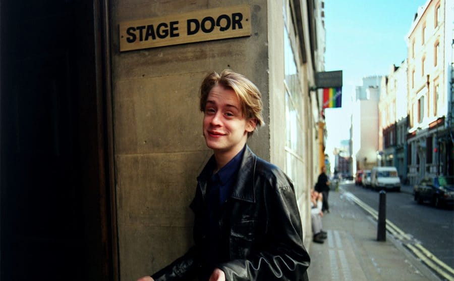 Macaulay Culkin walking in the Stage Door