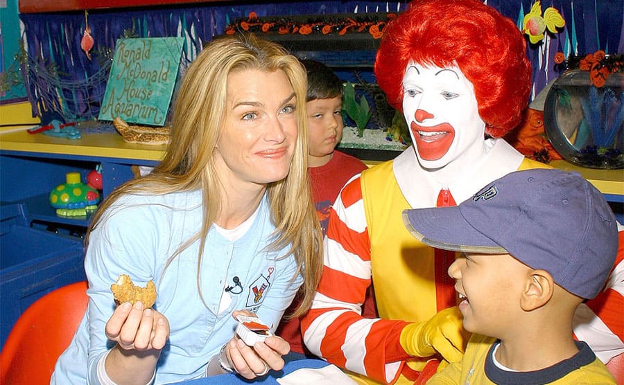 Brooke Shields with a Ronald McDonald at the Ronald McDonald house