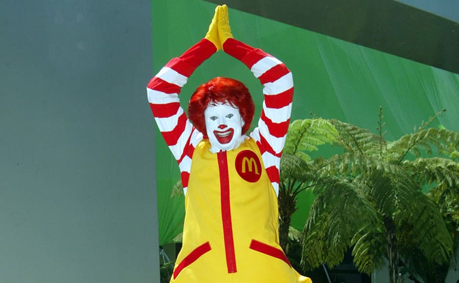 Ronald McDonald leaping in the air