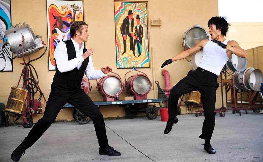 Brad Pitt and Mike Moh playing Cliff Booth and Bruce Lee in a fight scene from Once Upon A Time In Hollywood
