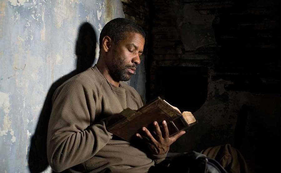Denzel Washington reading from the Bible in The Book of Eli