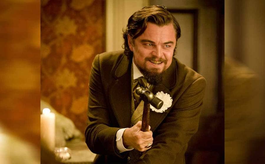 Leonardo DiCaprio holding a hammer in the film Django Unchained