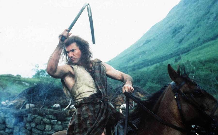 Mel Gibson waving num-chuks around the air while riding a horse in the film Braveheart