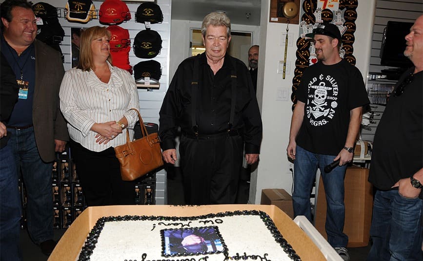 Richard Harrison on his 71st birthday with a large cake in the store