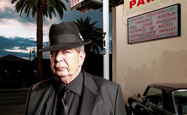 Richard Harrison in front of his pawnshop