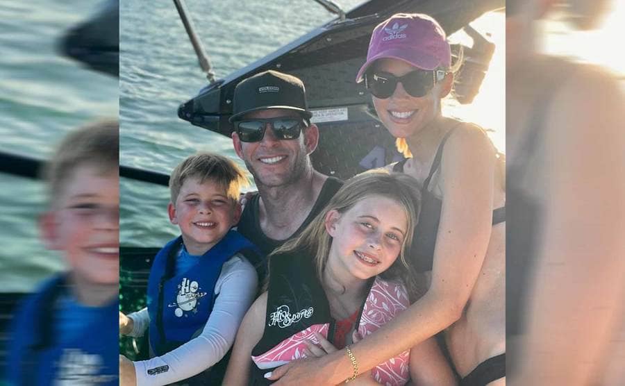 Tarek and Heather with his children wearing life jackets