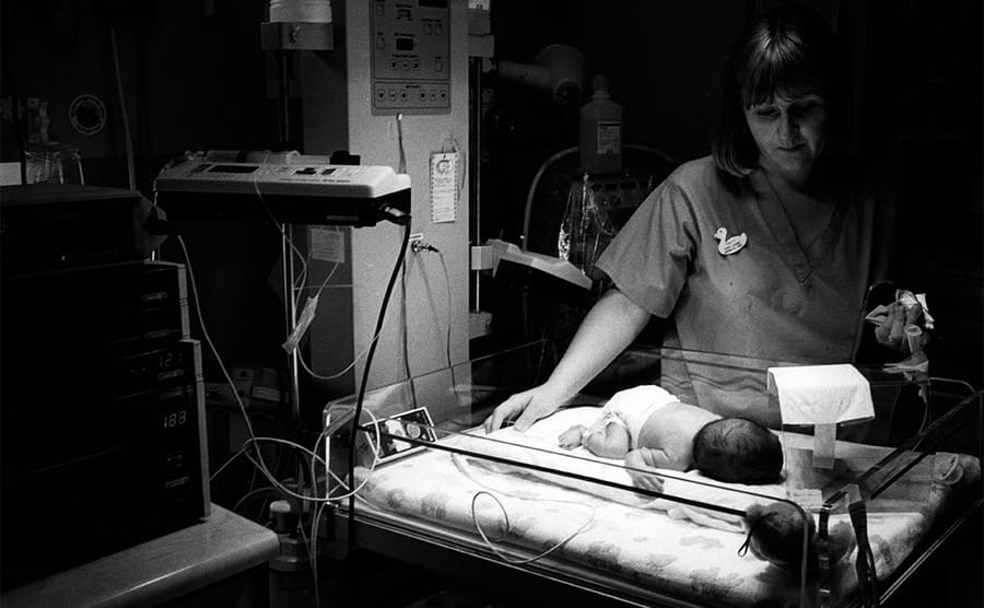 Midwife and a baby on the maternity ward