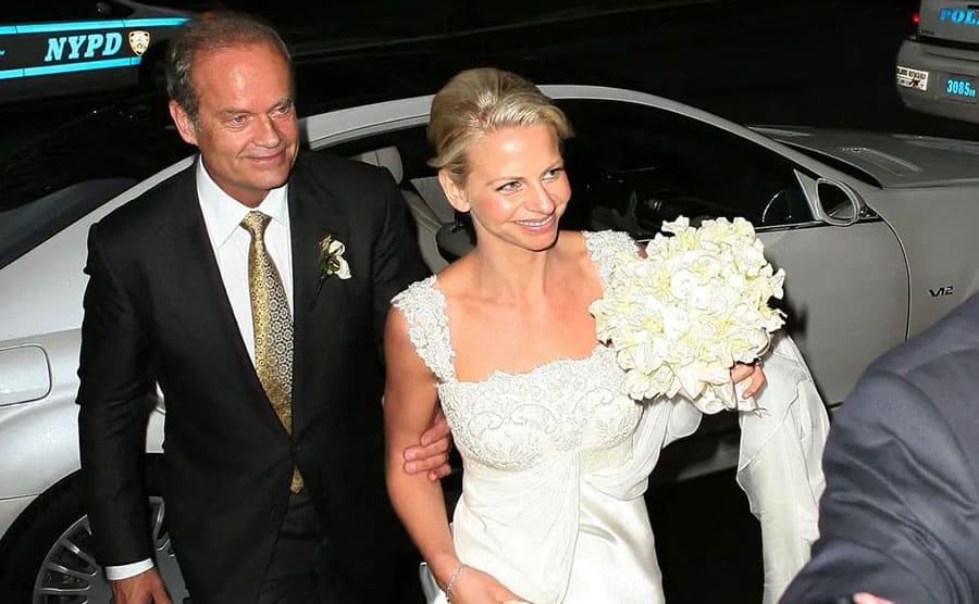 Kelsey Grammer and Kayte exiting a car on their wedding day