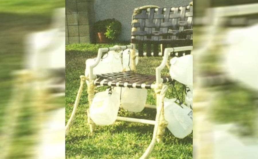 Larry’s lawn chair with gallon bottles attached