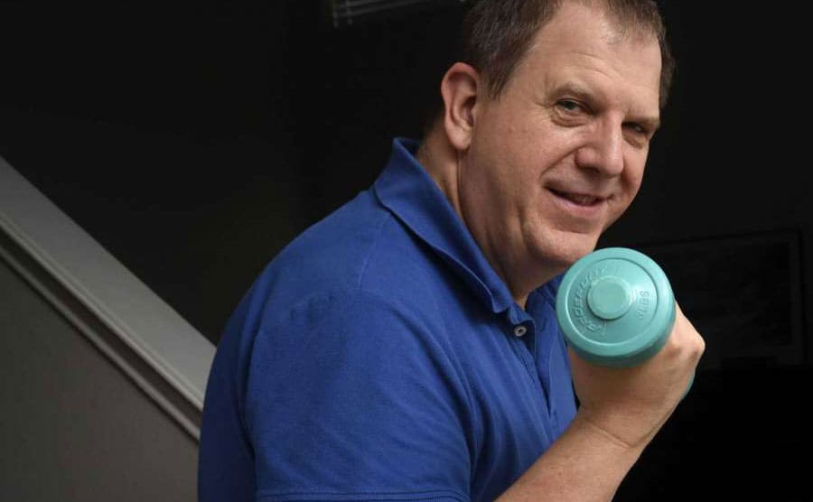 Ted using one of the weights he won on the Price is Right