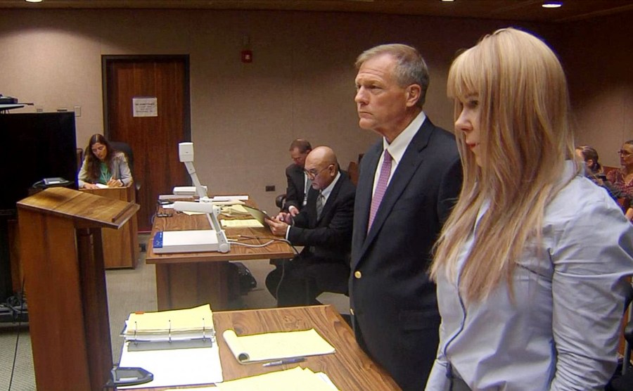 Alexandria with her lawyer standing in court