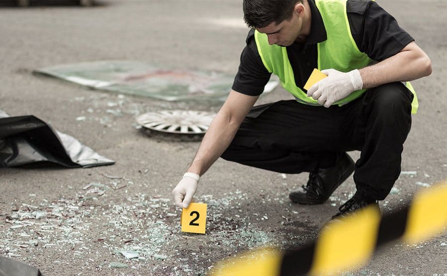 A policeman marking a crime scene