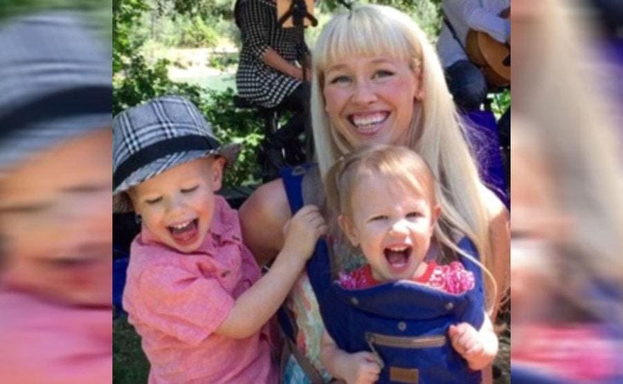 Sherri Hugging her two little children and all of them laughing