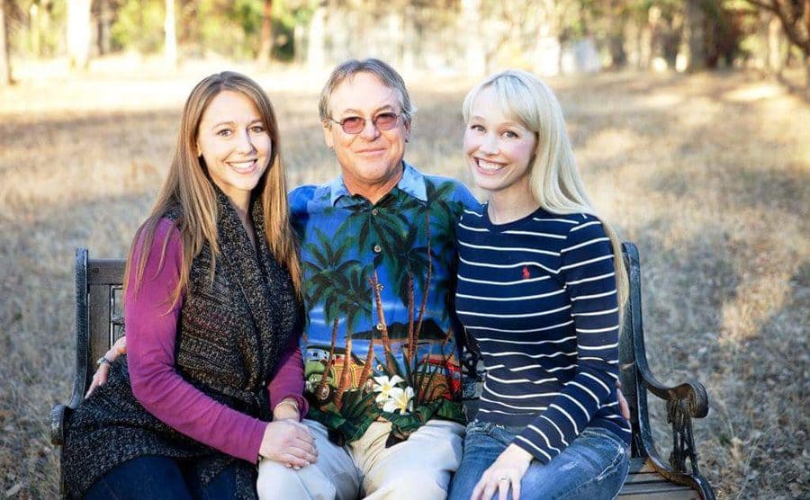 Sherri Papini sitting on a bench with her sister and father