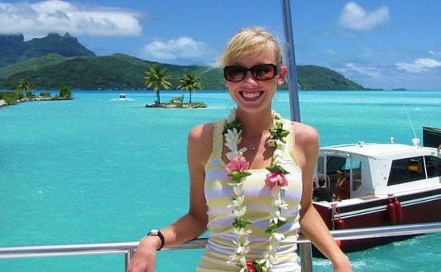 Sherri Papini smiling wearing a flowers wreath around her neck