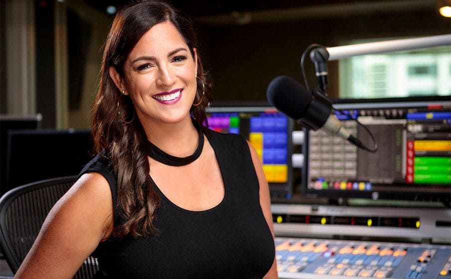 Sarah Spain sitting in a broadcast studio 