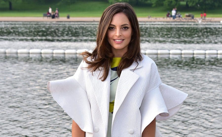 Olivia Wayne standing in front of a lake