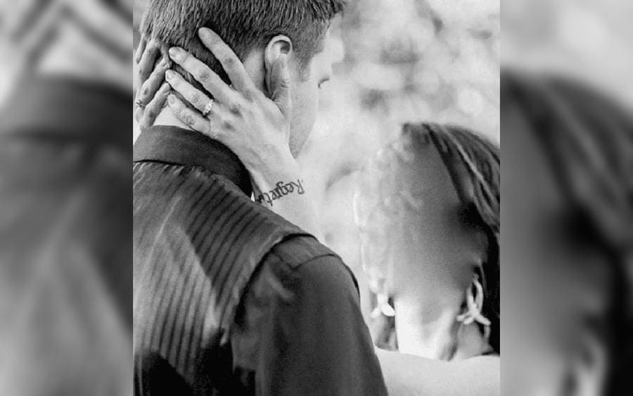 A woman on her wedding day with a tattoo that reads 