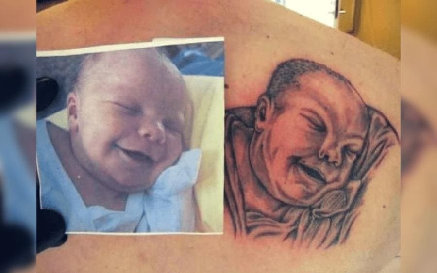 A tattoo of a baby that looks like an old person