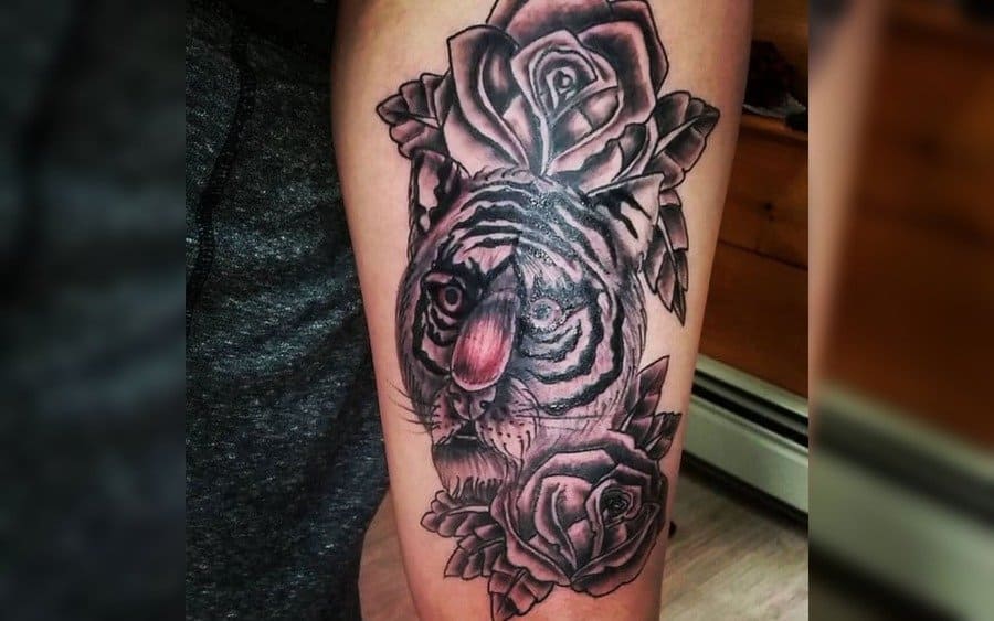 A tattoo of a lion that looks like a rose