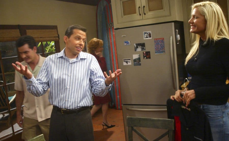 Jon Cryer talking to Janelle Pierzina in the kitchen on the set of Two and A Half Men