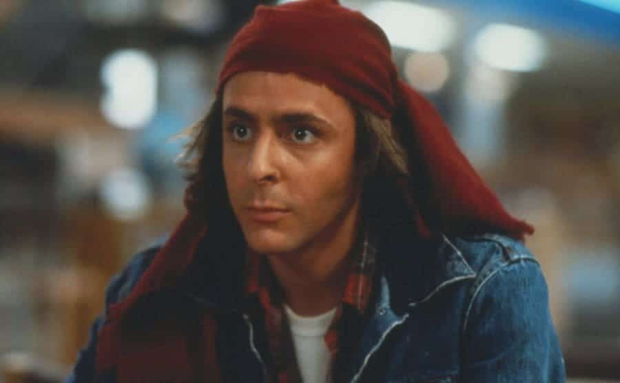 Judd Nelson as John Bender with a red bandana tied around his head