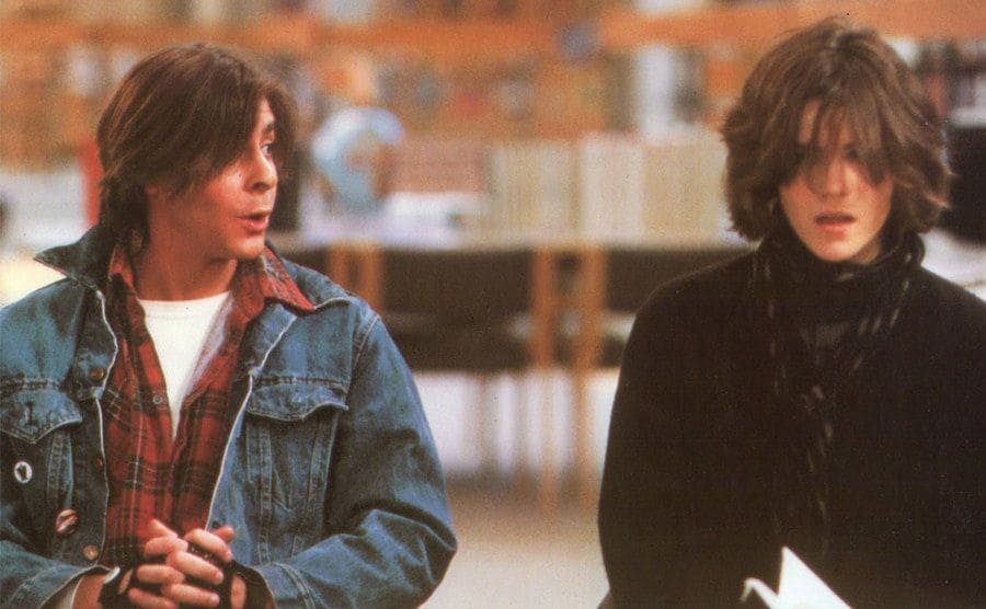 Judd Nelson and Ally Sheedy sitting in the library in a scene from The Breakfast Club