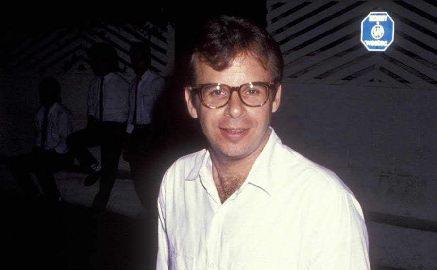 Rick Moranis photographed by paparazzi leaving a restaurant in 1991