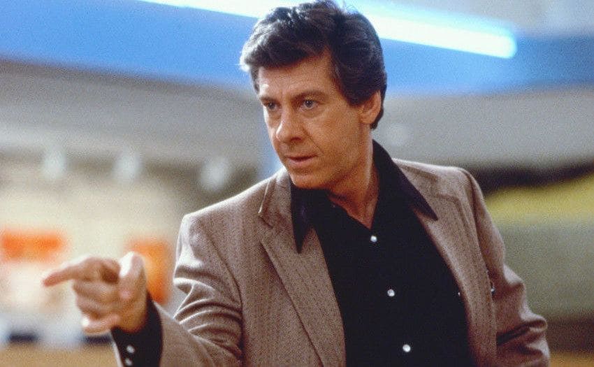 Paul Gleason as the principal angrily pointing his finger towards something out of the camera
