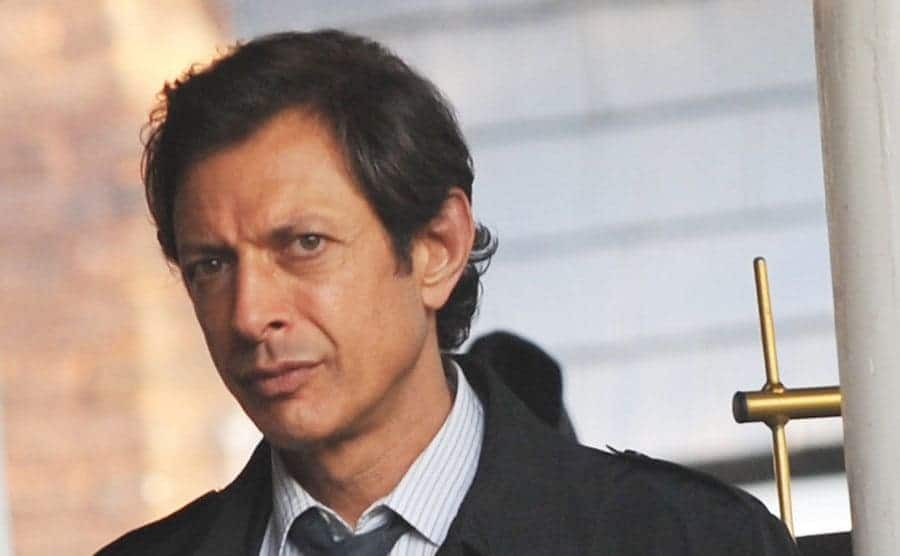 Jeff Goldblum as Zack Nichols walking through the street