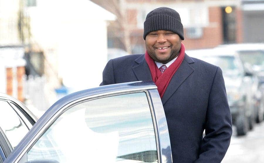 Anthony Anderson as Kevin Bernard getting into a car in a scene from Law and Order