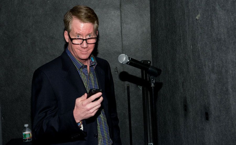 Steve Zirnkilton recording in front of a microphone