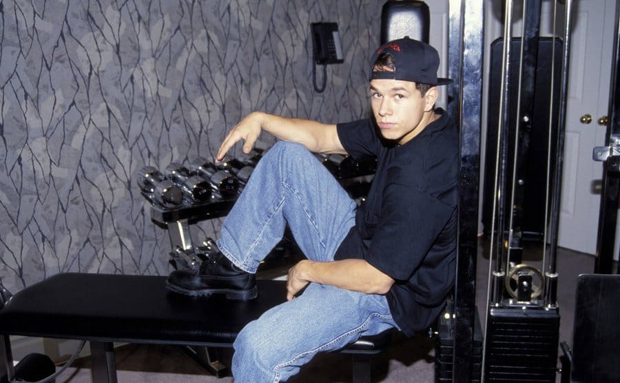 Mark Wahlberg posing on gym equipment