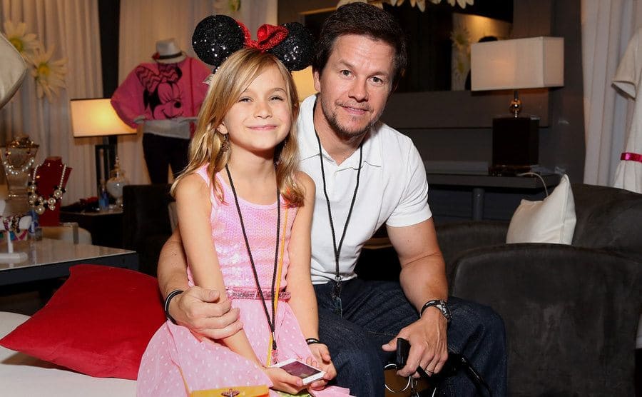 Mark Wahlberg with his daughter Ella posing in a dressing room