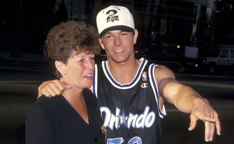 Alma Wahlberg with Mark Wahlberg pointing something out while arriving to an event in 1994
