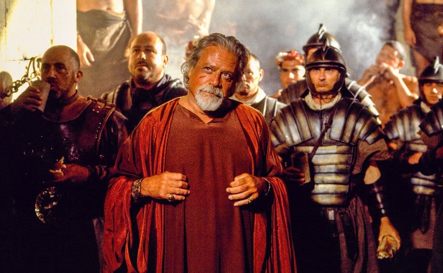 Oliver Reed surrounded by soldiers