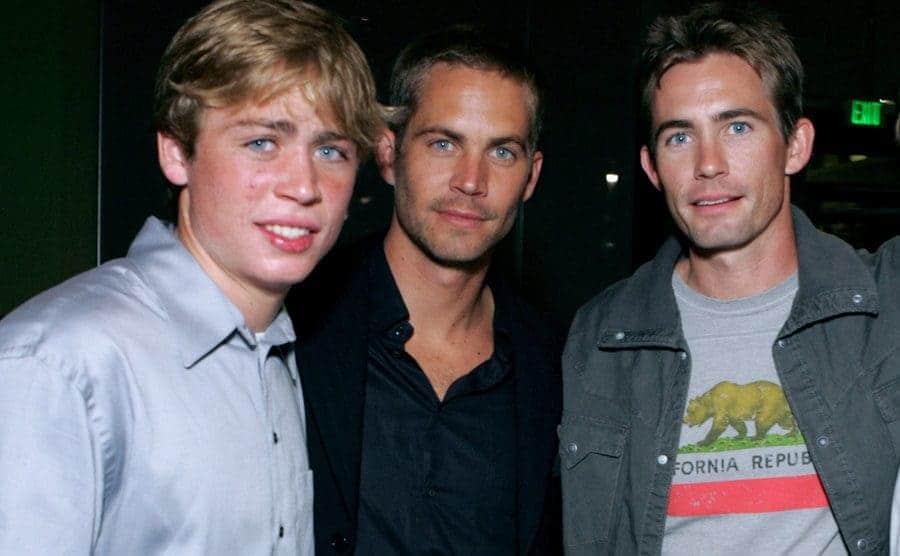 Cody, Paul, and Caleb Walker posing on the red carpet