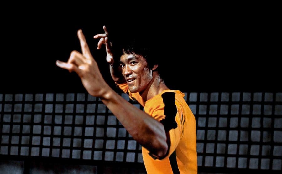 Bruce Lee in Game of Death with his hands up ready to fight