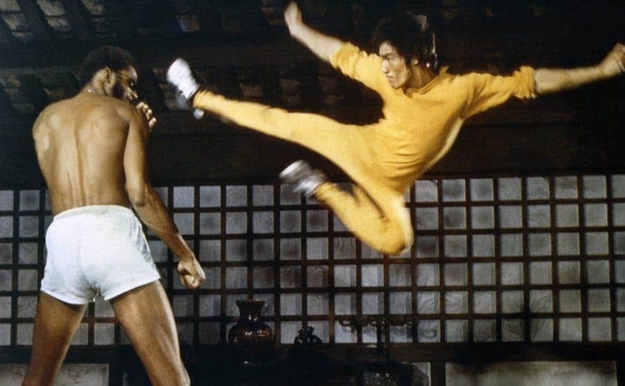 Bruce Lee mid-air about to kick Kareem Abdul-Jabbar