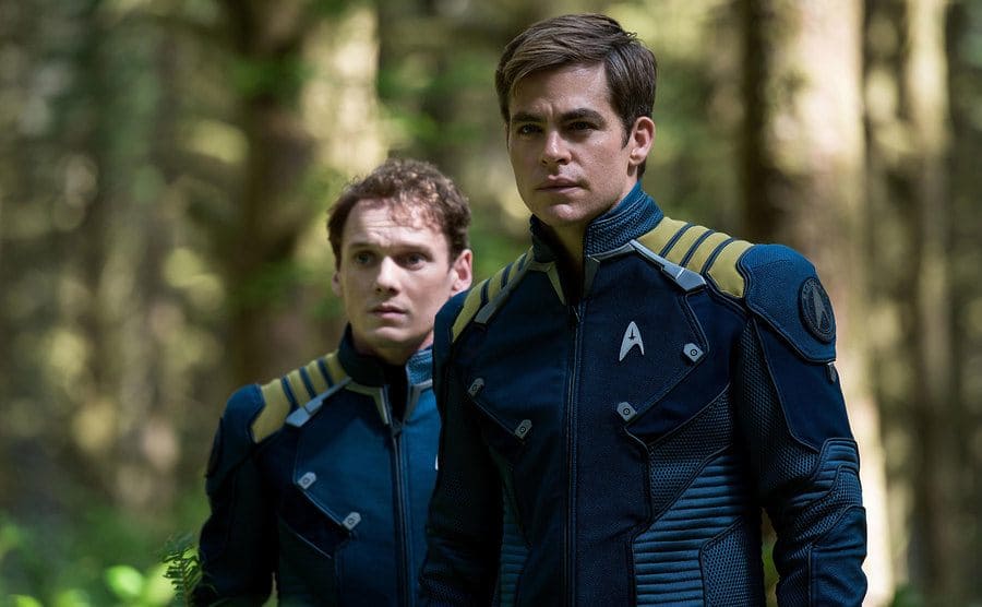 Anton Yelchin and Chris Pine in uniforms in a scene from Star Trek