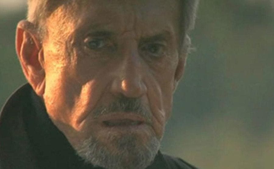Roy Scheider looking into the distance in a scene from Iron Cross