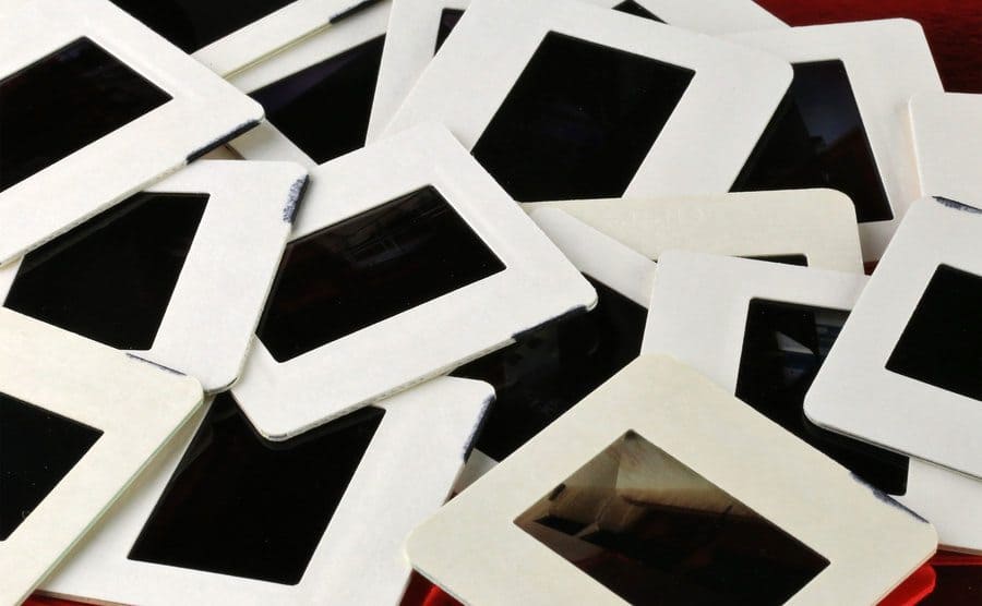 A pile of film slides for reproduction and projection.